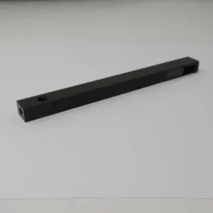 A black bar with two holes on top of it.