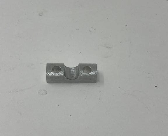 A piece of metal sitting on top of a table.