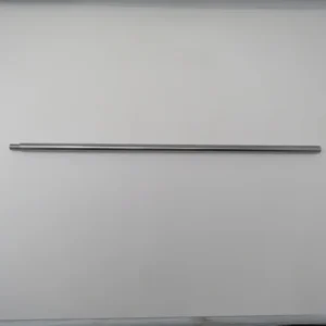 A metal rod is hanging on the wall.