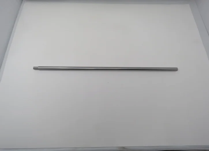 A metal rod is hanging on the wall.