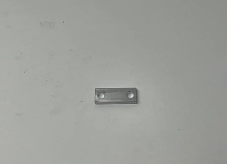 A metal bar with two holes on the side.