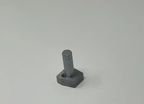 A gray square object sitting on top of a table.