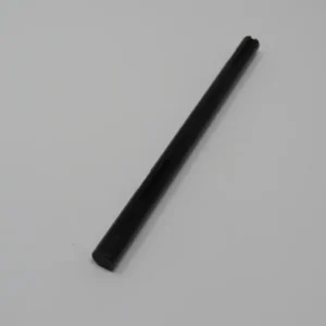 A black stick is sitting on top of the floor.