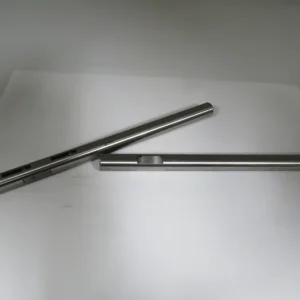 A pair of metal rods sitting on top of a table.