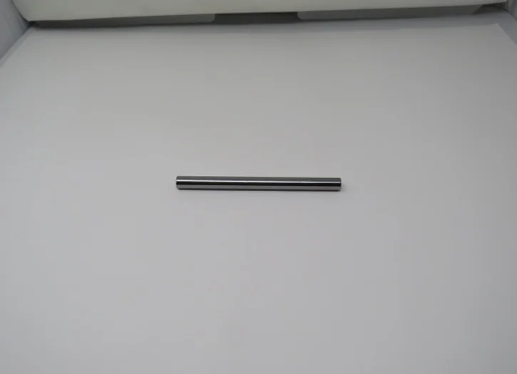 A metal rod sitting on top of a wall.