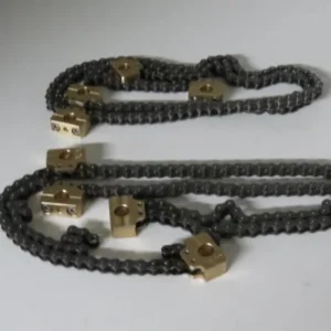 A chain with gold plated brass blocks attached to it.