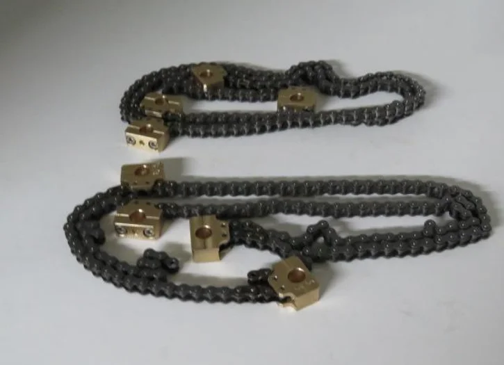 A chain with gold plated brass blocks attached to it.