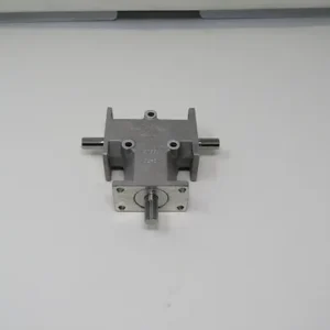 A metal piece of machinery sitting on top of a wall.